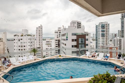 Bocagrande Apartment | Cartagena Vibes Rooftop pool Beach access Fine dining Shopping Couples Business travelers Medical guests