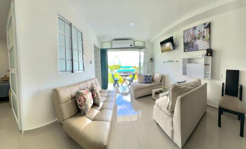 Cali Apartment | Aptos Amoblados & Modernos en Cali, family-friendly Cerca Imbanaco y Tequendama centro deportivo Edificio de colores