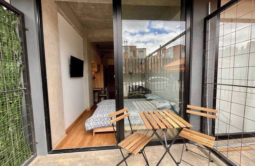 Quinta Paredes Apartment | Loft with a private garden and coworking space near Corferias and the U.S. Embassy