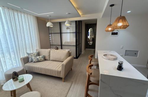 Riomar Apartment | Open Floor Chic Interior Design Pool Full Kitchen