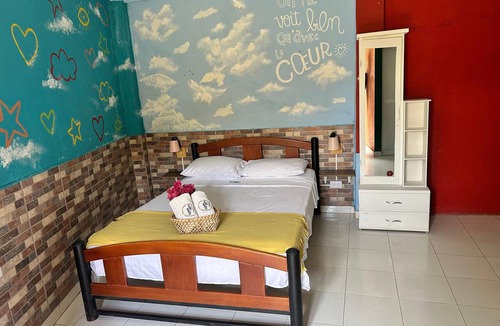 Taganga Hotel | Resort with a pool, ocean view, bar, and restaurant.