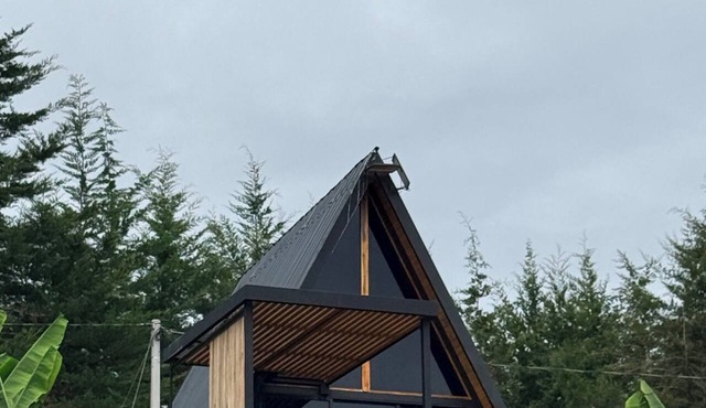 Cabin with a private hot tub and a view of the mountains