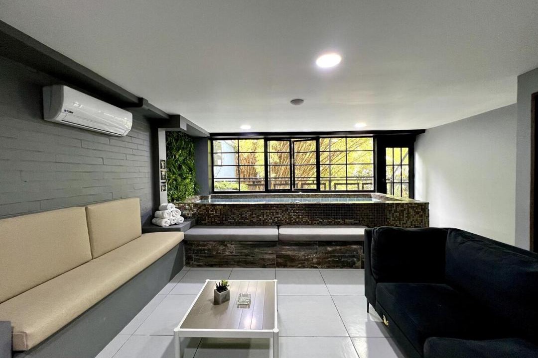Zona Rosa Apartment | FUOCO - NOWA Apt with Bar, Indoor Heated Pool, by Lleras Park