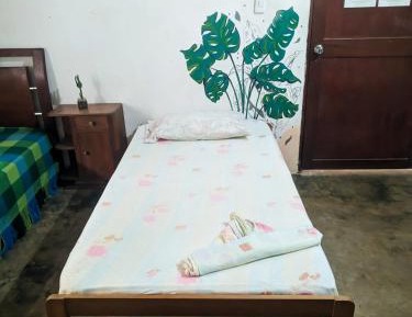 Single Bed in Dormitory Room