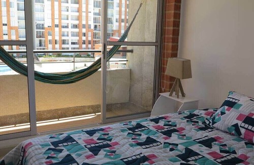 Girardot Condo | Modern Elegance | Gem with Balcony and Four Pools