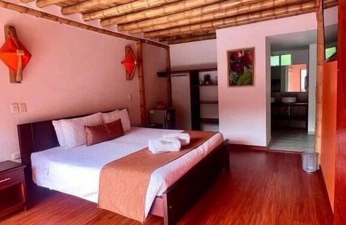 Zetaquira Hotel | Hotel y termales Las Heliconias