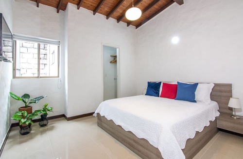 Astorga Apartment | Cozy Penthouse next to Poblado Park with Large Balcony and A/C