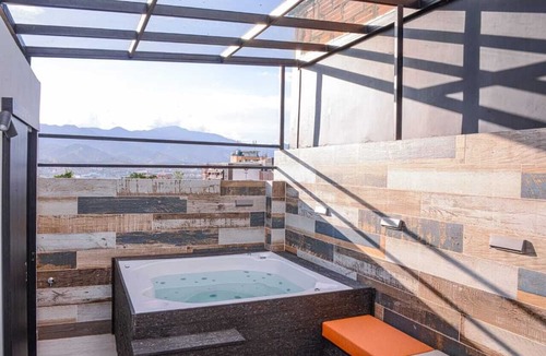 La Florida Apartment | 3 Bedroom Duplex PH Middle of Lleras Private Roof with Hot tub. No fees guests