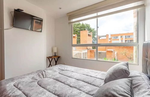 Usaquen Apartment | La Calleja Warm and Illuminated