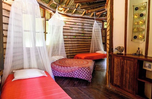 Restrepo Cabin | Eco-friendly structure, inspired by a Yarumo leaf, ideal for couples, families, or small groups of up to five guests. Surrounded by tropical nature. Enjoy breakfast, a natural pool, forest trails, birdlife, and peaceful cabin designs.