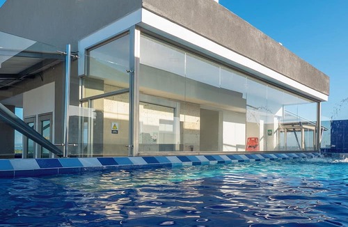 Urbanizacion Eliana Condo | Luxury Airport Penthouse 4 BD 3 BA + Rooftop Pool