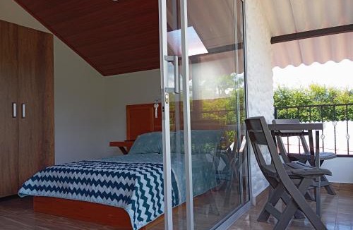 Pacho House | Habitación Orquídea - Hospedaje Rural La Fortaleza Pacho