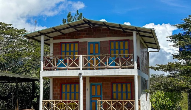 A cabin nestled among the mountains, birds, and a magical view in El Queremal in Valle del Cauca