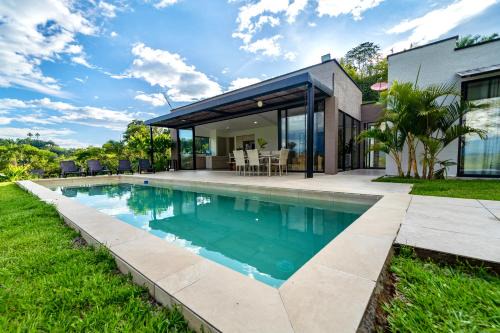 Modern Villa Surrounded by Nature and Gardens with Pool and Stunning Mountain and River Views